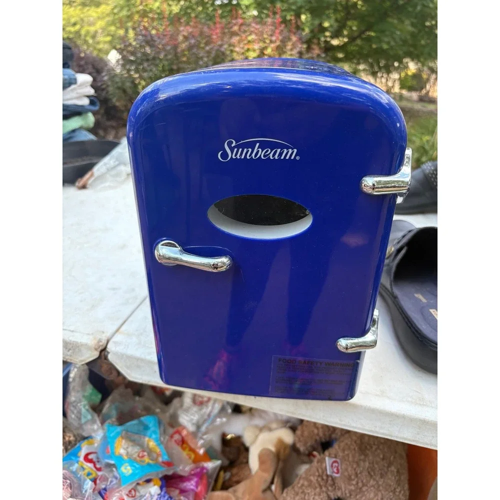 Sunbeam mini-fridge, a compact and portable cooling and warming unit.